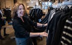 Allison Kaplan peruses the racks at Requisite boutique for her startup, Mother Of, a website that curates mother-of-the-bride fashions.