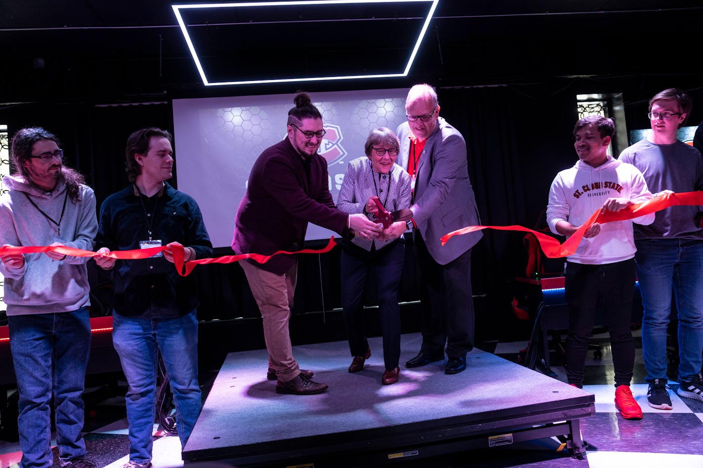 St. Cloud State officials at ribbon-cutting ceremony for e-sports arena.