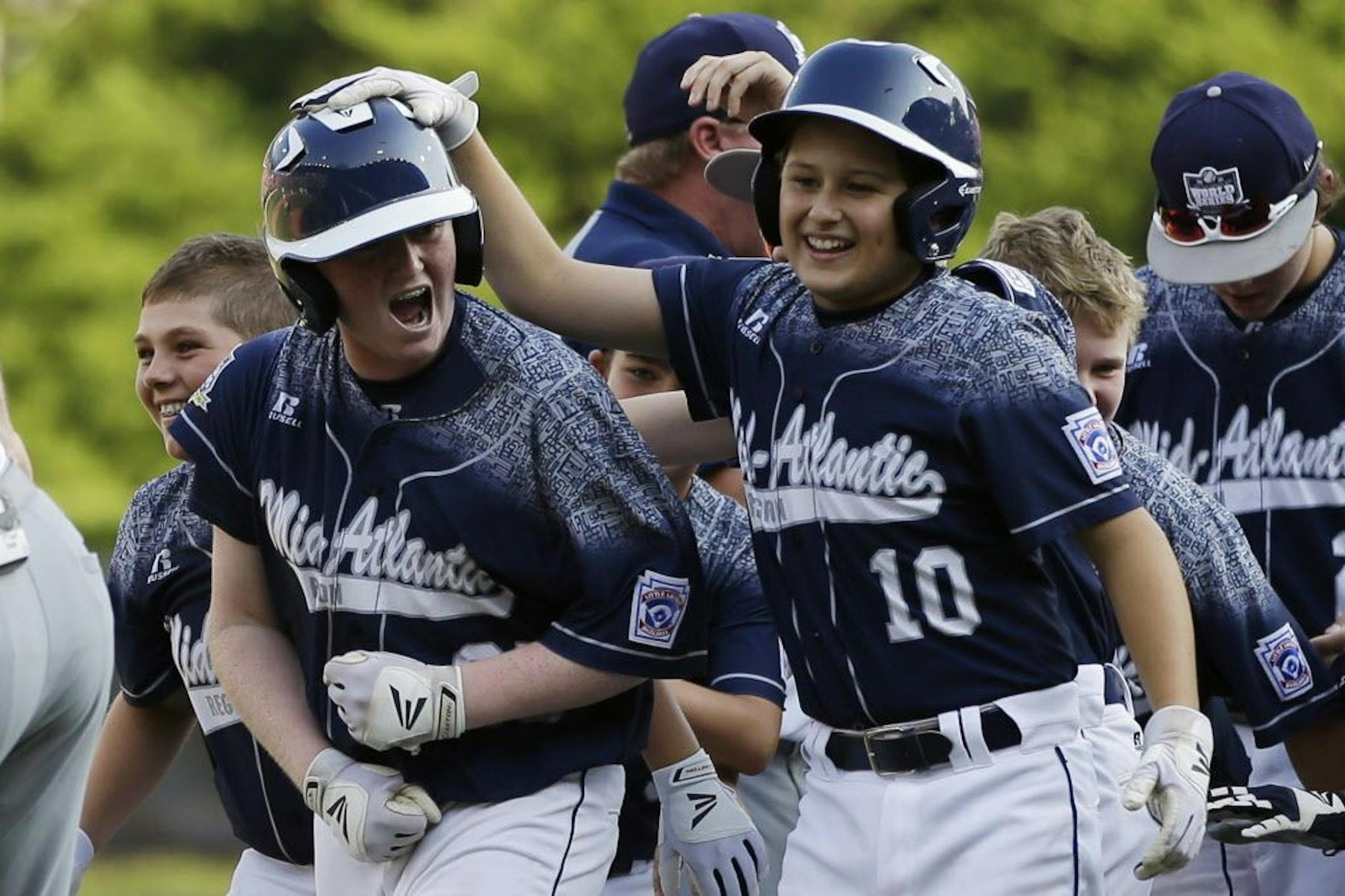 Lewisberry, Pa.'s Chayton Krauss (25) celebrates with teammates after his game-winning hit during the sixth inning of the U.S. championship baseball game against Pearland, Texas, at the Little League World Series, Saturday, Aug. 29, 2015, in South Williamsport, Pa. Lewisberry won 3-2.