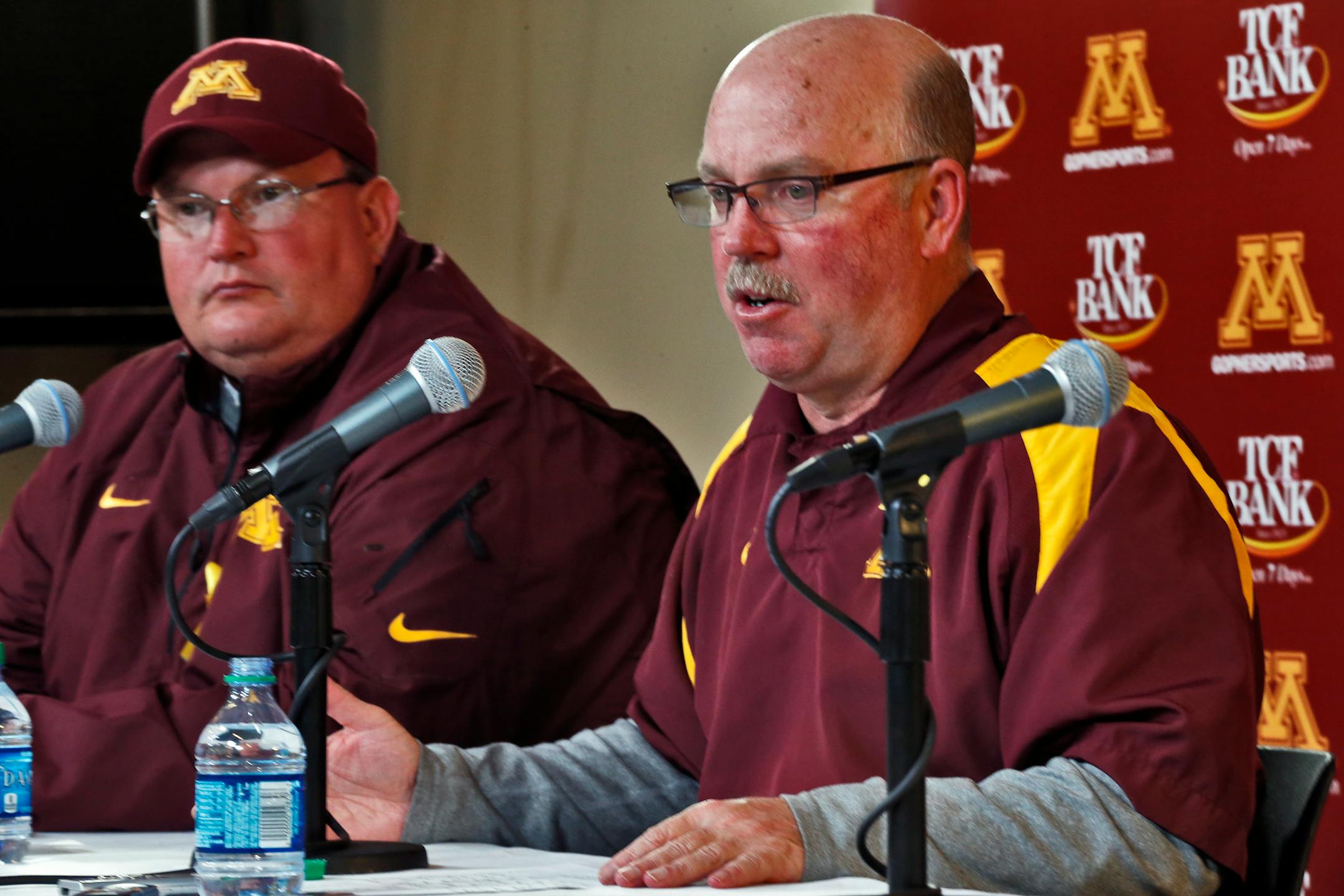 Tracy Claeys, left, and former coach Jerry Kill