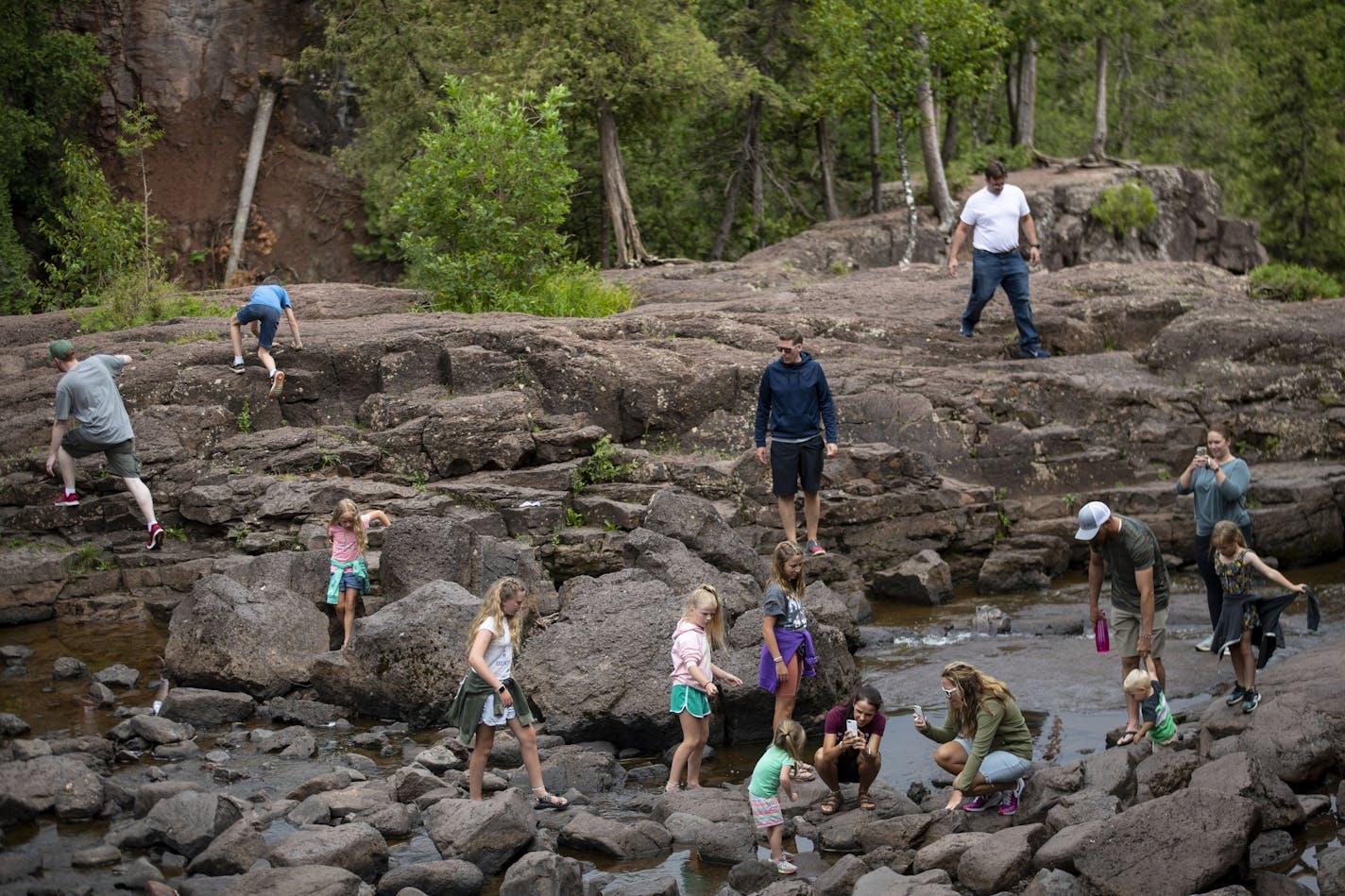 A large group of visitors stopped to enjoy Gooseberry Falls on Tuesday despite the pandemic.