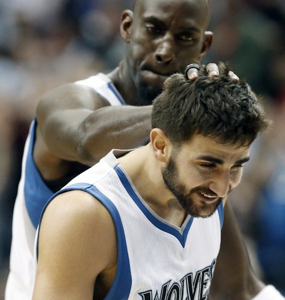 Wolves point guard Ricky Rubio, right, got a congratulatory head push from Kevin Garnett after a basket in the second half against the Portland Trail 