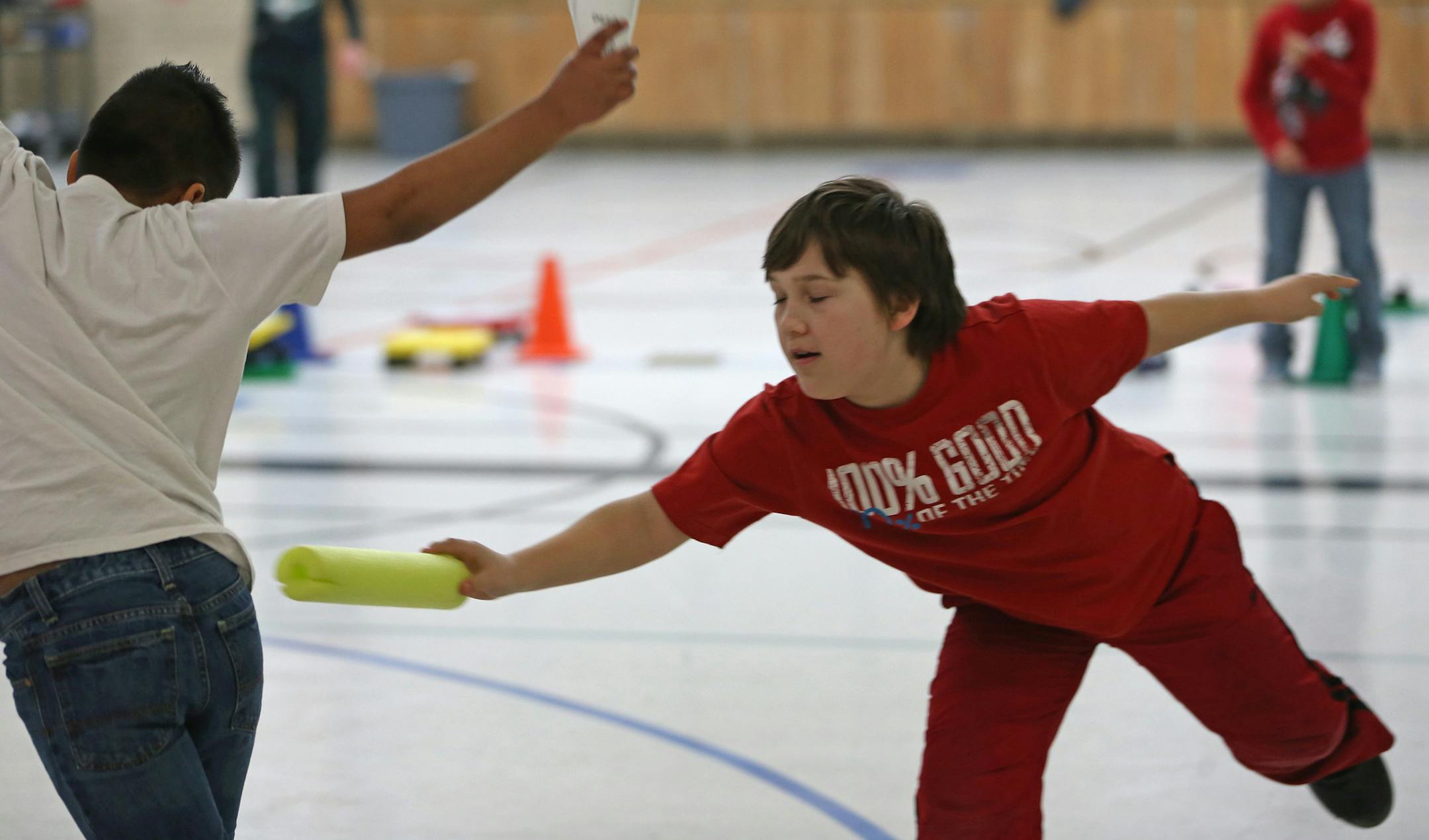 (left to right) Students Nestor Gonzalez and Gregory Goedker played tag, during a game of "Runing Math at the school gym on 4/18/13. Jo Zimmel, a gym teacher at Garlough Elementary School in West St. Paul, was honored by Dakota County for her efforts to promote healthier living. She's initiated projects designed to increase students physical activity through various clubs for running, biking and snowshoeing. Zimmel represents the school on the district wellness committee, and provides training t