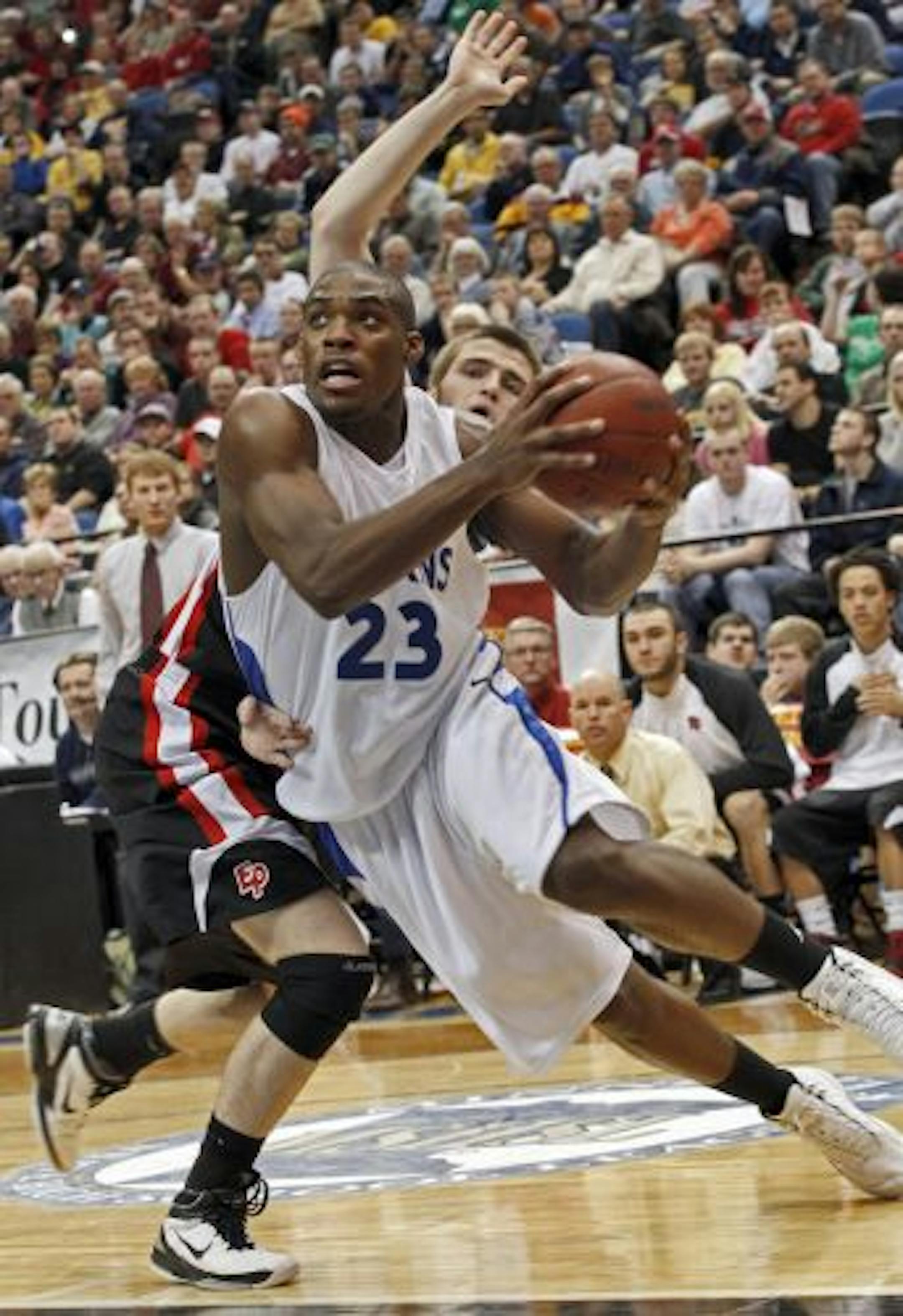 Hopkins' Marvin Singleton slashed to the basket for a layup during the Royals' 64-52 victory over Eden Prairie for the Class 4A boys' basketball championship Saturday night.