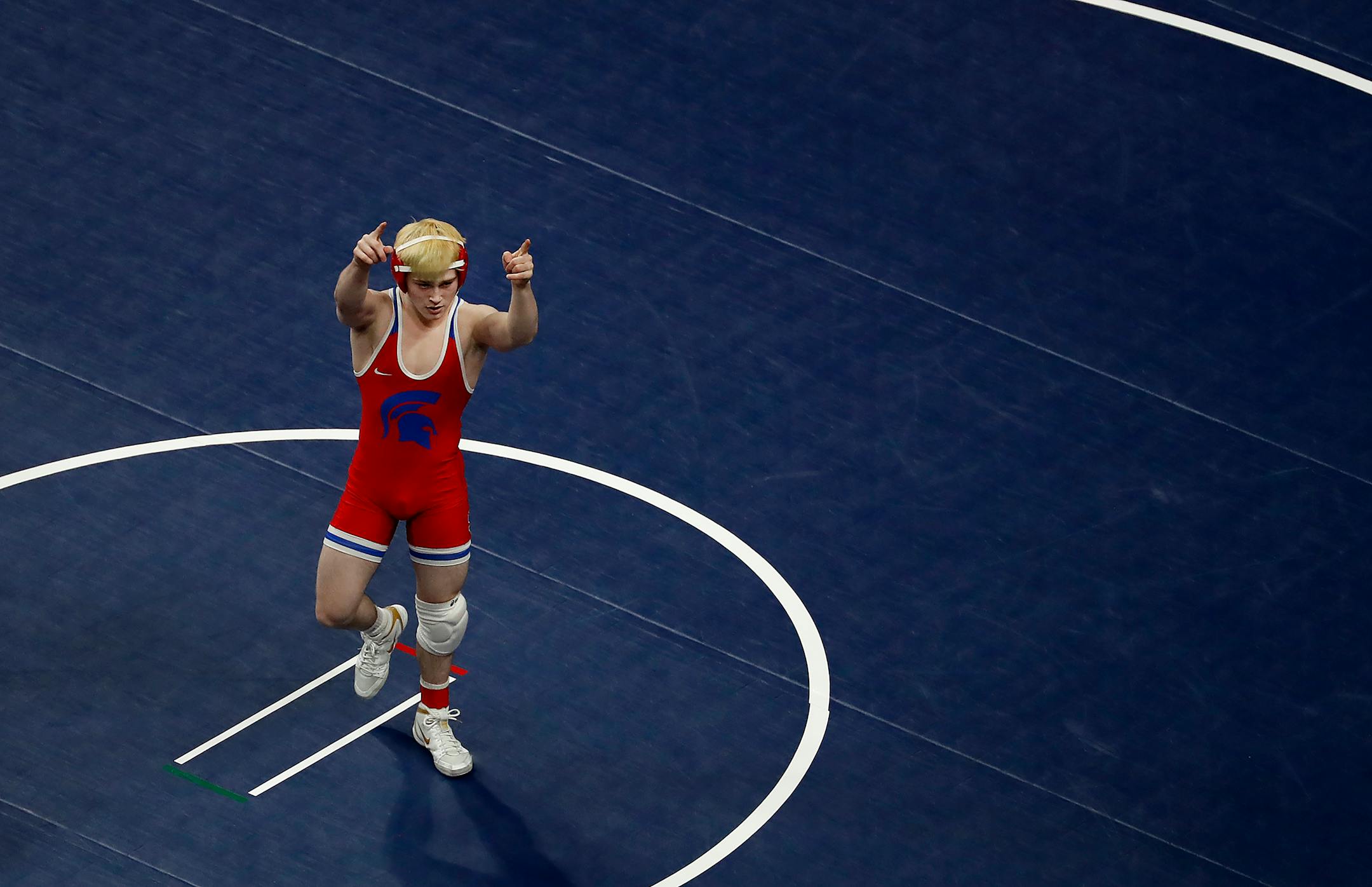 Ryan Sokol of Simley celebrated after quickly pinning Conner Roth of Marshall in the 132-pound class.