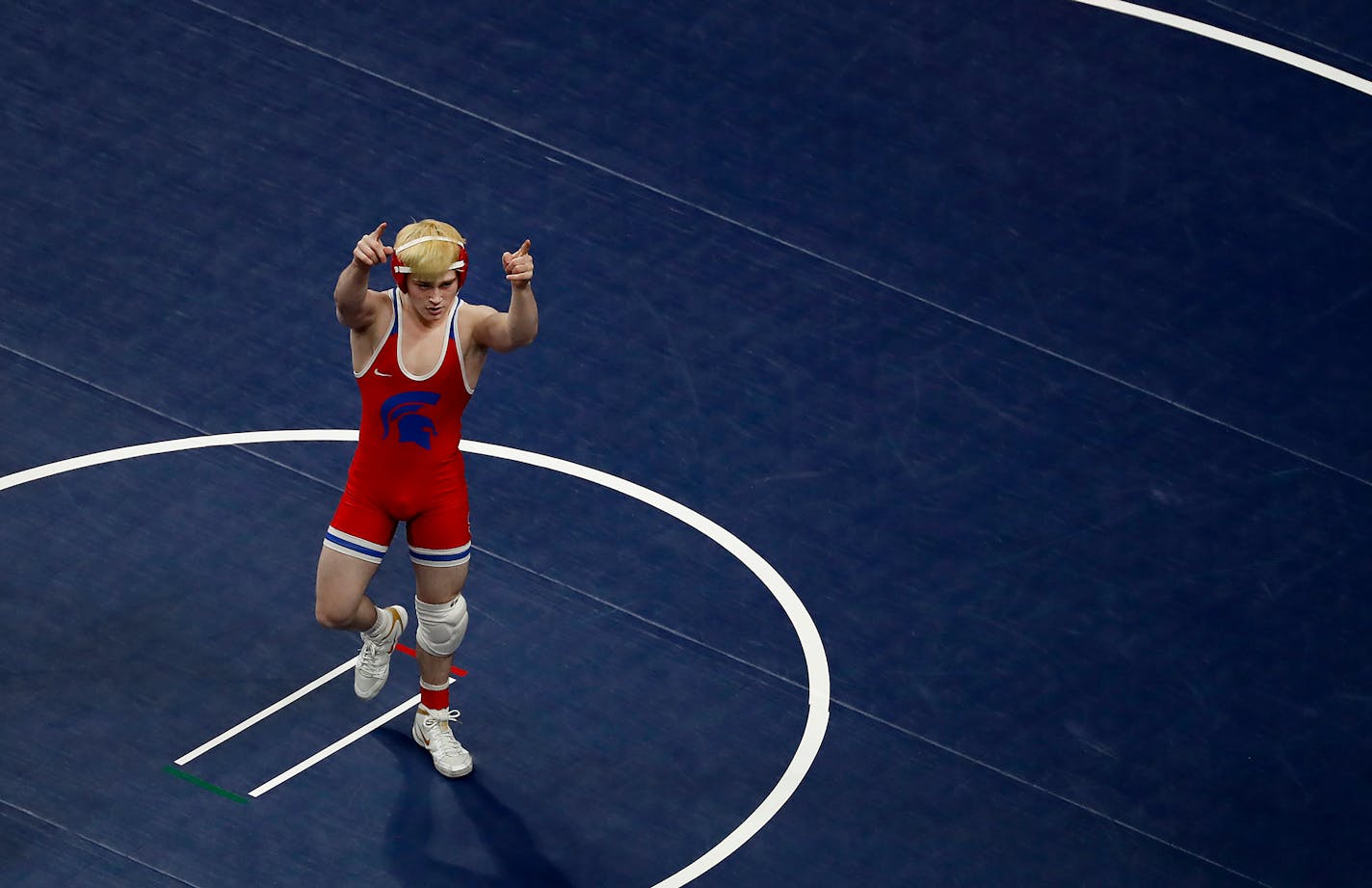 Ryan Sokol of Simley celebrated after quickly pinning Conner Roth of Marshall in the 132-pound class.