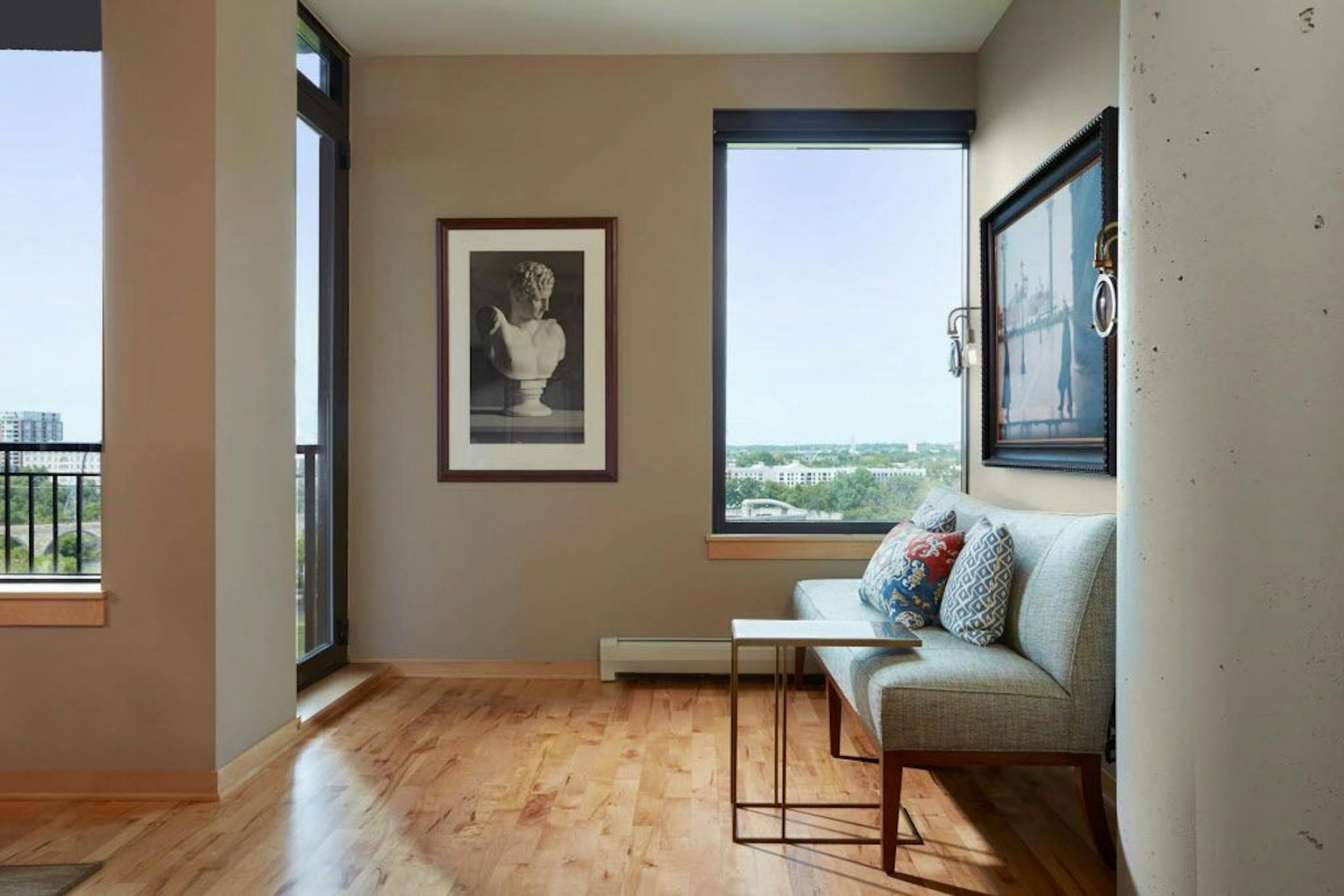 An art gallery nook showcases Stone Arch Bridge views and some of the couple's art collection.
