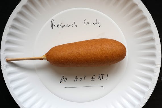A “research corndog” is ready for testing in the laboratory of Christopher Faulk, an associate professor of functional genomics in the University 