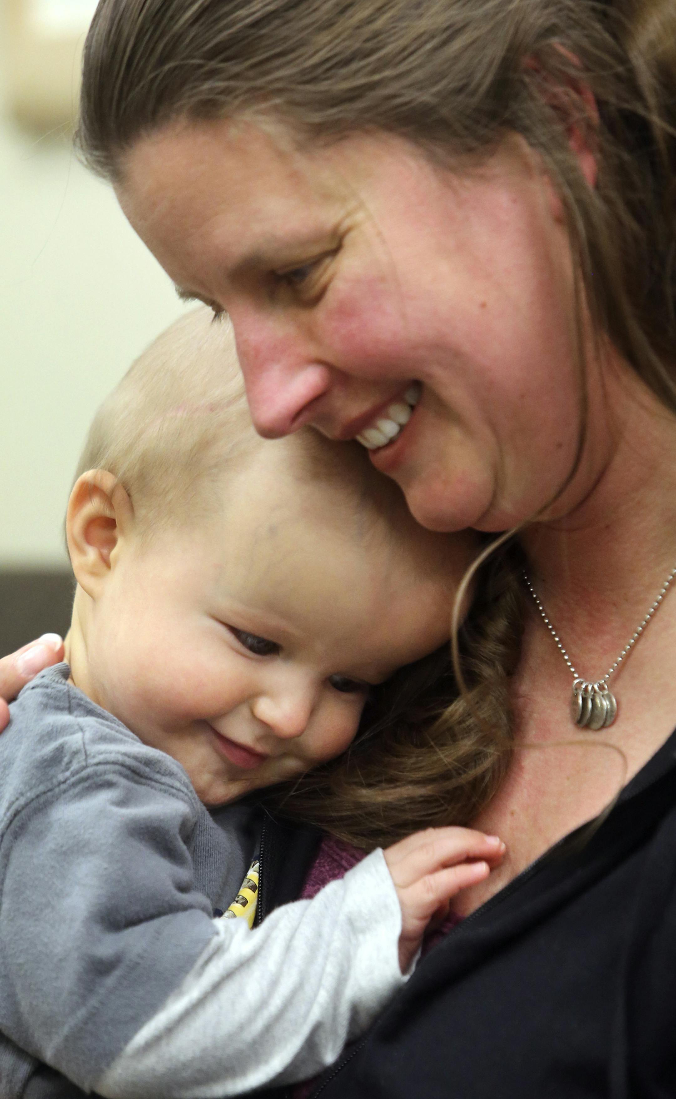 Dr. Suzanne Pauly with her son Michael, eight months, Tuesday, May 6, 2014, at Gillette Children's Specialty Healthcare in St. Paul, MN. Michael was born with synostosis, a birth defect in which the bones of the skull fuse too soon, and had surgery in December to reshape the bones of his skull. Michael is now doing well.](DAVID JOLES/STARTRIBUNE) djoles@startribune Dr. Suzanne and Jason Pauly are the parents. Michael is the baby. Michael was born 8/27/13 with synostosis, a birth defect in which