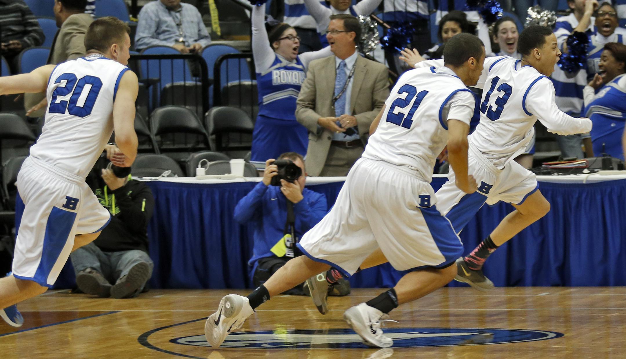 Hopkins Amir Coffey (13) led the victory celebration after he launched a shot from behind the half-court line at the end of the fourth overtime to give Hopkins the victory. ] Class 4A Boys Basketball Tournament. Hopkins vs. Shakopee. Hopkins won in four overtimes 49-46.(MARLIN LEVISON/STARTRIBUNE(mlevison@startribune.com)