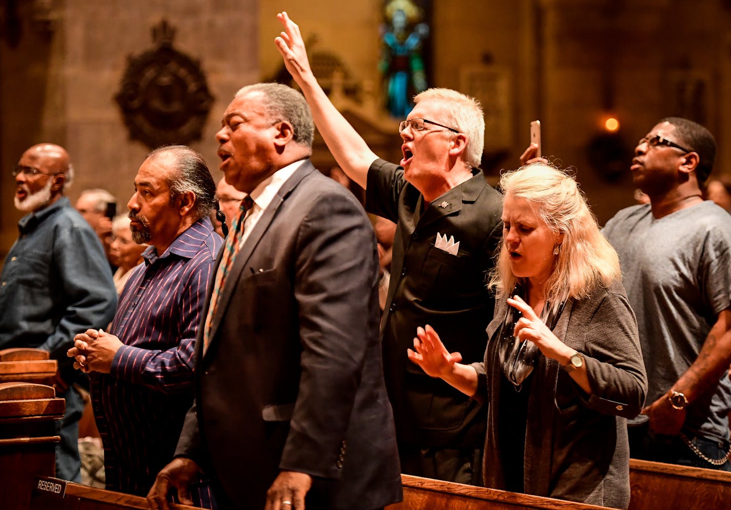 Attendees of Friday night's "The Dream Continues" service sang along with the song, "How Great is Our God," performed by the Minnesota State Baptist Convention Choir Friday night. ] AARON LAVINSKY &#xef; aaron.lavinsky@startribune.com About 100 folks packed the Basilica of St. Mary Friday night in a belated celebration of civil rights leader Martin Luther King &#xf3; and also to demonstrate a growing alliance between Minnesota&#xed;s historic African American churches and predominantly white con