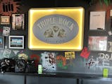 At the new Punk Rock Museum in Las Vegas, the old sign from Minneapolis’ defunct Triple Rock Social Club hangs behind the bar.