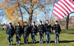 Reenactment soldiers attended the dedication ceremony Saturday for Cpl. Daniel Bracken's new headstone at St. Anthony Cemetery in northeast Minneapoli