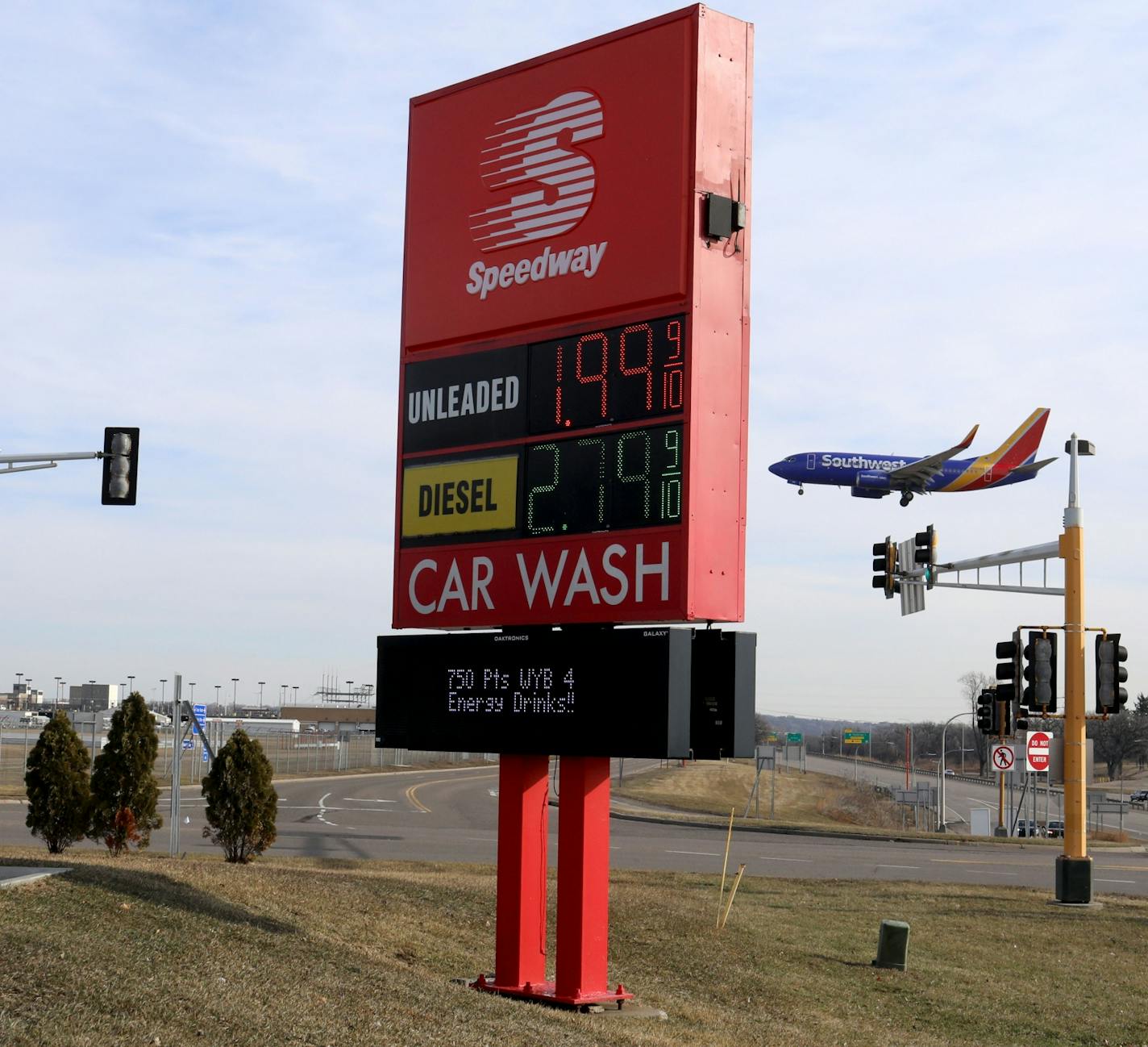 A Southwest Airlines jet comes in for a landing at MSP near the Speedway on Post Road where gas and oil prices were already below $2 a gallon last week.