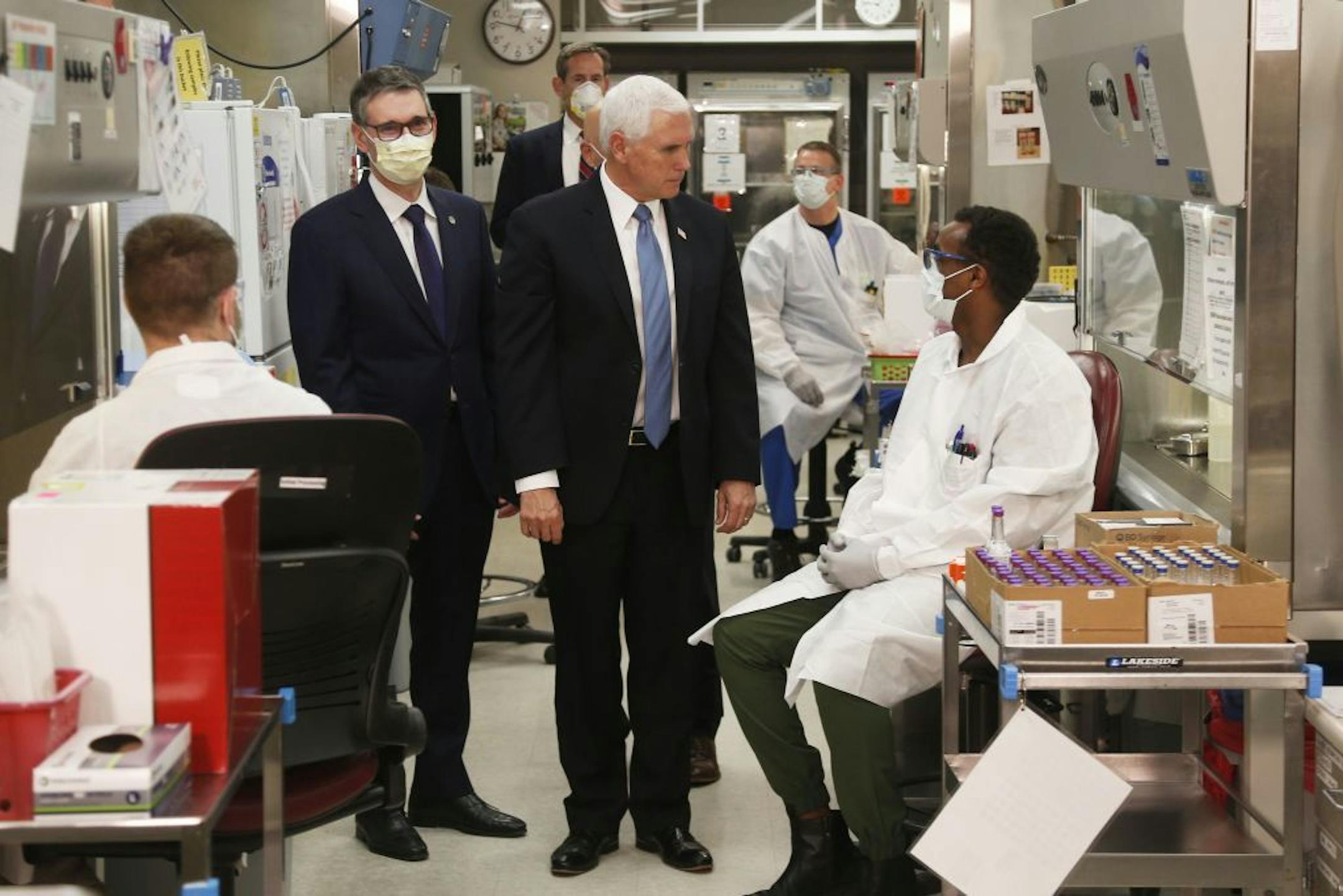Vice President Mike Pence visits the molecular testing lab at Mayo Clinic Tuesday, April 28, 2020, in Rochester, Minn., where he toured the facilities supporting COVID-19 research and treatment. Pence chose not to wear a face mask while touring the Mayo Clinic in Minnesota. It's an apparent violation of the world-renowned medical center's policy requiring them.