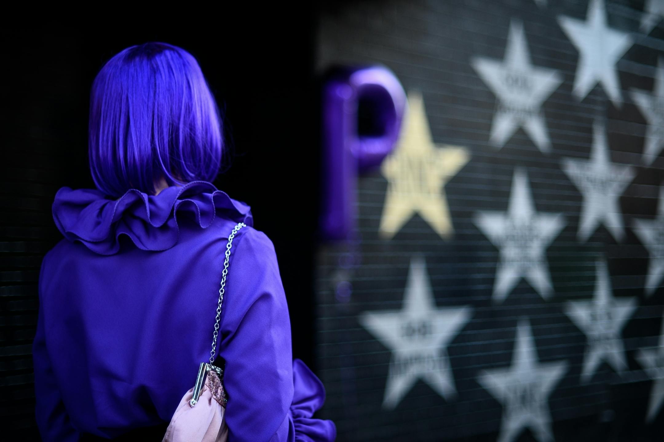 Heather Whitebread, of Coon Rapids, looked at the Prince star at First Avenue before taking photos with it Friday.
