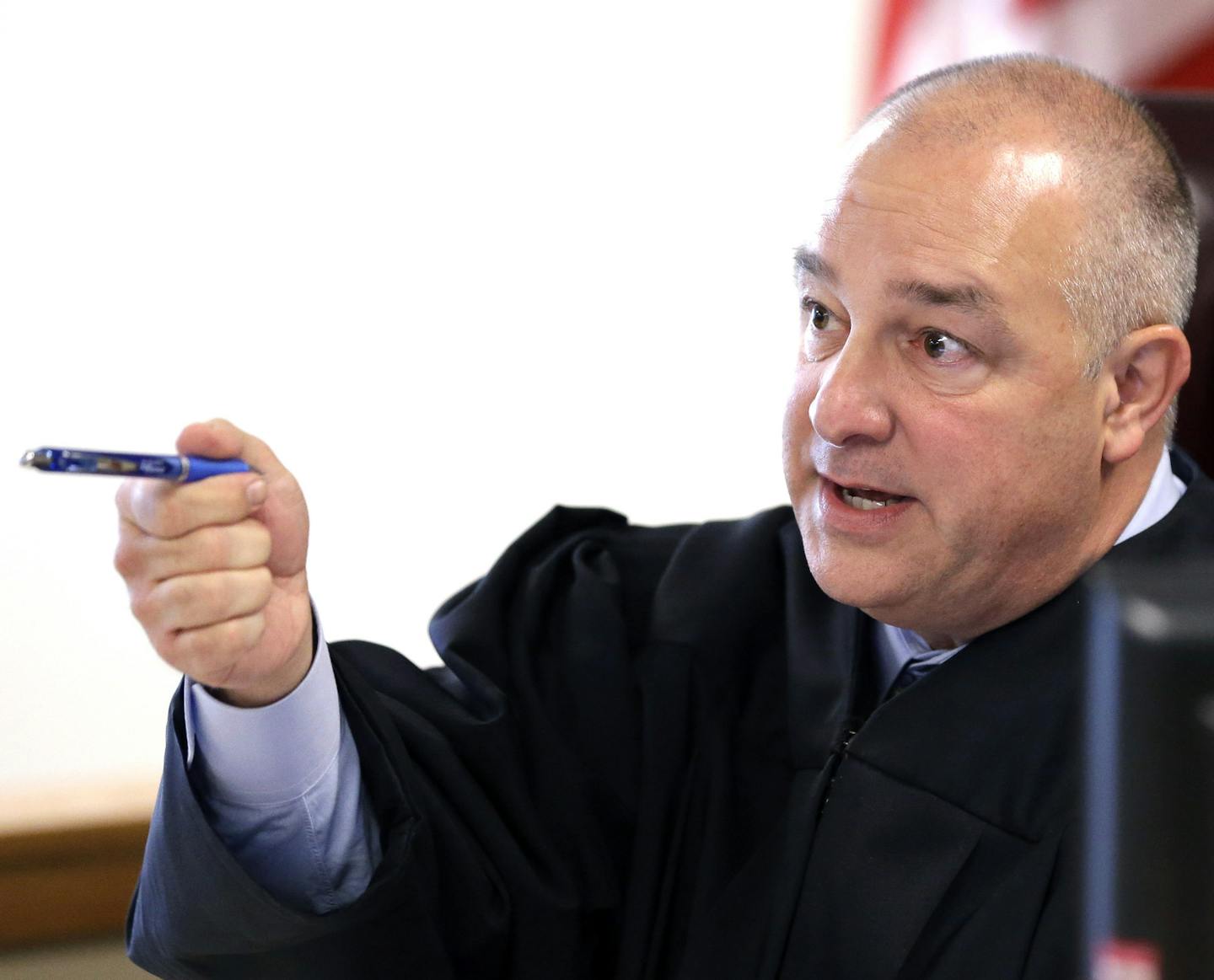 State District Judge Kelly W. Case addresses the courtroom before calling the docket Wednesday, Oct. 8, 2014, in Conroe, Texas. Minnesota Vikings running back Adrian Peterson made his first court appearance in Case's court. The judge tentatively set a Dec. 1 trial date for Peterson on a charge of felony child abuse for using a wooden switch to discipline his 4-year-old son. (AP Photo/David J. Phillip, Pool)