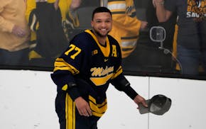 Michigan's Marshall Warren smiles after helping his team defeat Michigan State in the NCAA regional finals on March 31 in Maryland Heights, Mo.