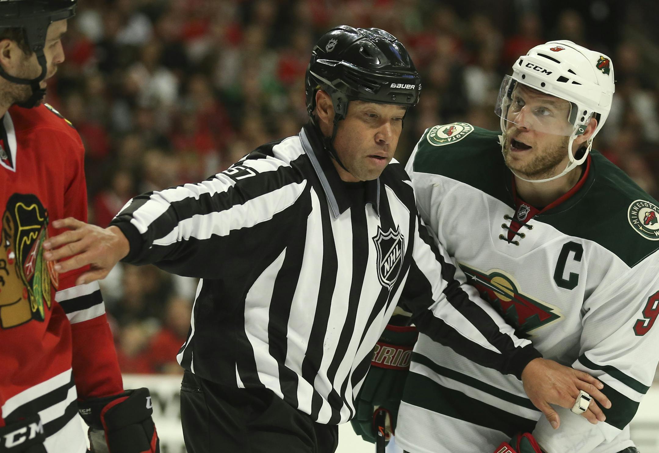 Chicago Blackhawks defenseman Niklas Hjalmarsson and Minnesota Wild center Mikko Koivu traded barbs in the third period Sunday afternoon at United Center in Chicago.