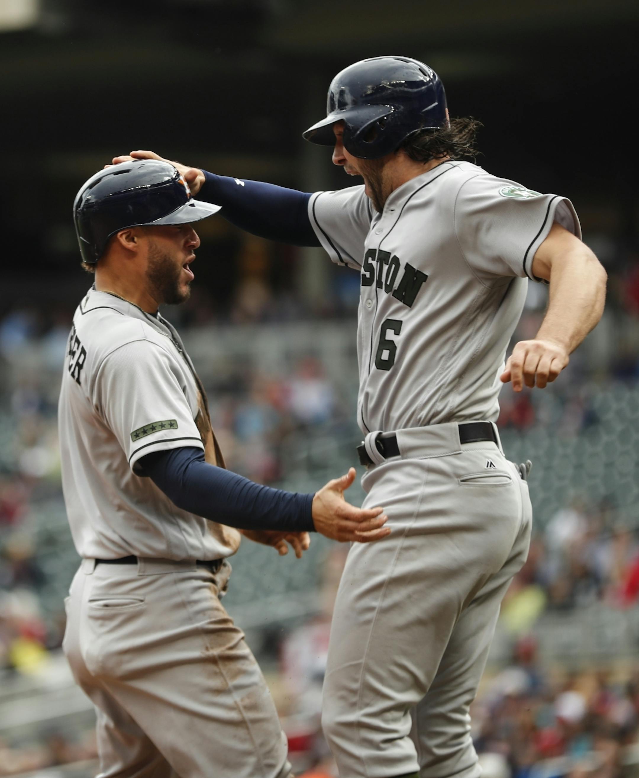 Houston's George Springer (4) and Jake Marisnick (6) celebrated after both scoring on a double by Josh Reddick (22) in the top of the 8th inning at Target Field in Minneapolis, Minn. on Monday, May 29, 2017. Houston score 11 points in the inning.