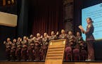 Interim Colonel Christina Bogojevic reads the oath of office to 35 cadets graduating the Minnesota State Patrol's 68th and 69th training academy.