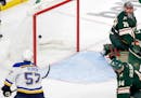 David Perron (57) of the St. Louis Blues gets the puck past Minnesota Wild goalie Marc Andre Fleury (29) for a goal in the third period Monday, May 2,