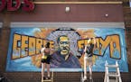 Artists complete a mural of George Floyd outside of Cup Foods, Thursday, May 28, 2020 in Minneapolis.
