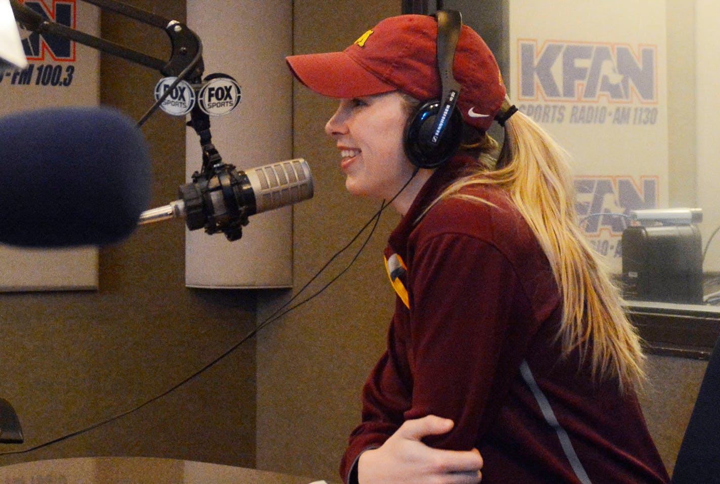 Women's hockey co-captain Rachel Ramsey fills listeners in on hockey-related news at KFAN Sports Radio in this Feb. 16, 2015 photo. Ramsey, who will finish her hockey career this semester, has hopes of working in sports news in the future. (AP Photo/The Minnesota Daily, Juliet Farmer)