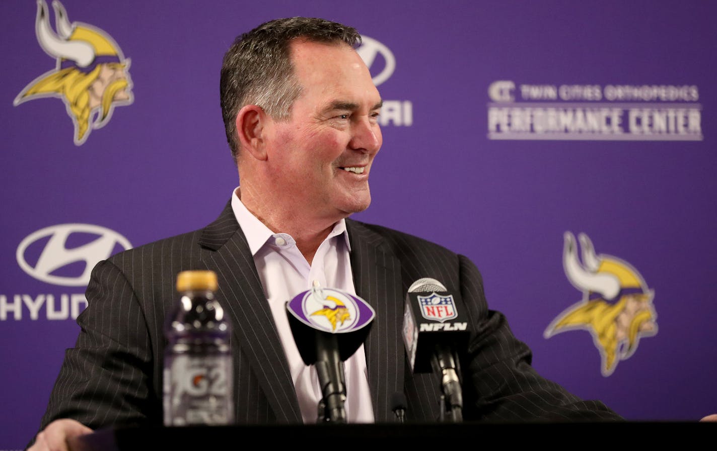 Minnesota Vikings head coach Mike Zimmer glances over at first round pick cornerback Mike Hughes from the University of Central Florida as he introduced Hughes to local media members Friday, April 27, 2018, at the Twin Cities Orthopedics Media Center.] DAVID JOLES &#xef; david.joles@startribune.com Vikings CB Mike Hughes will be introduced at 5:00 p.m. CT on Friday, April 27 at the Twin Cities Orthopedics Media Center.