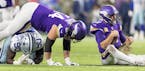 Vikings quarterback Kirk Cousins had to pick himself up after being sacked by DeMarcus Lawrence of the Cowboys in the third quarter.