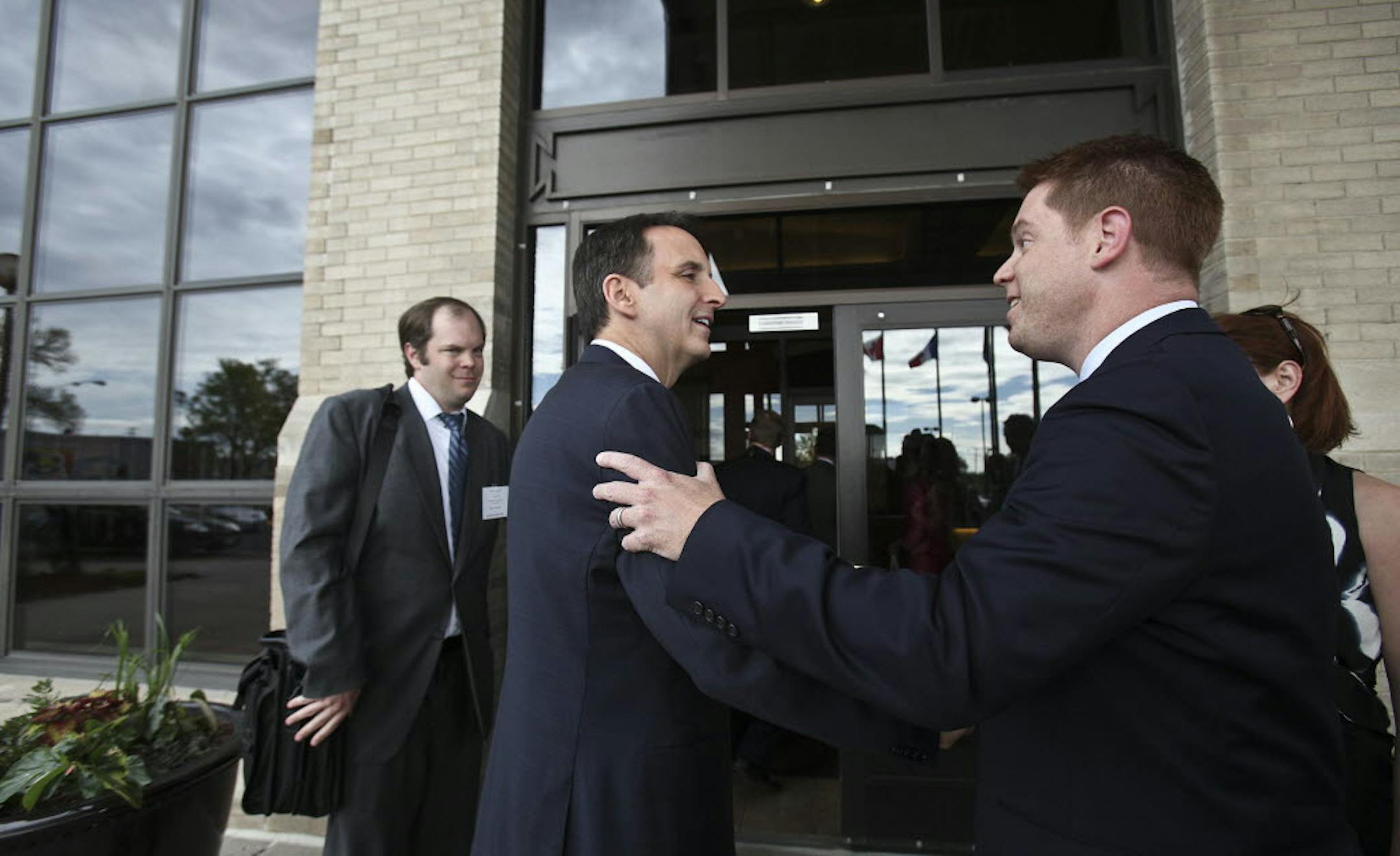 Tim Pawlenty talked to his press secretary, Brian McClung, after arriving at a private fundraiser at the International Market Square in Minneapolis.