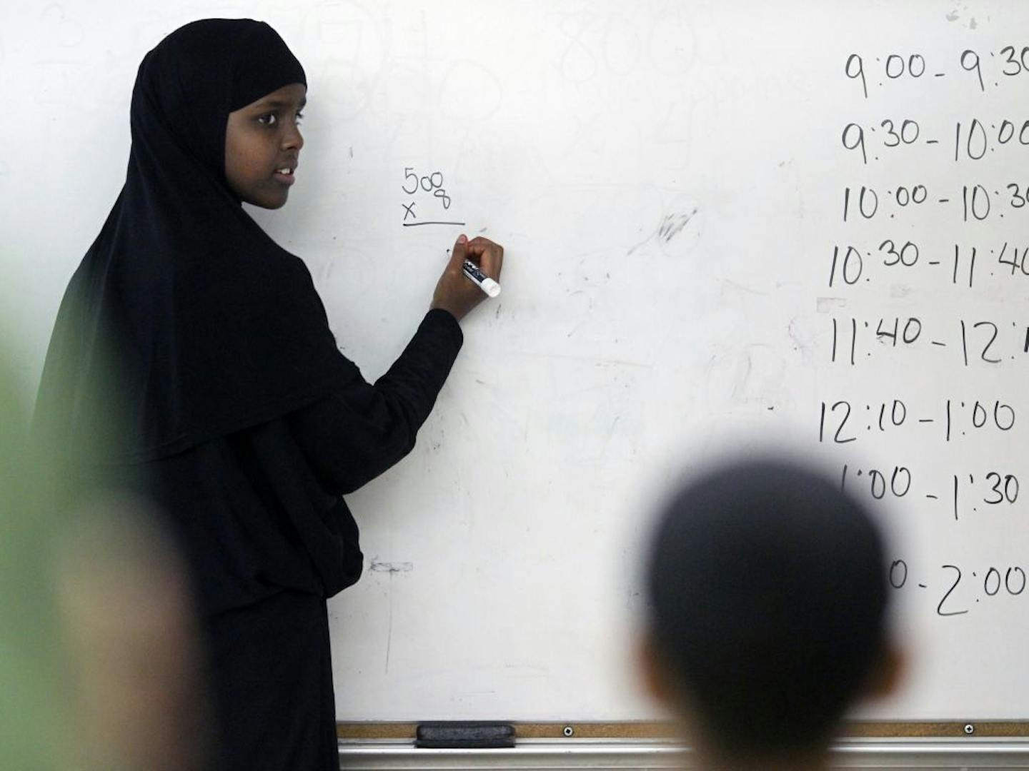 On June 29th, 2011, students do some math exercises during summer school.