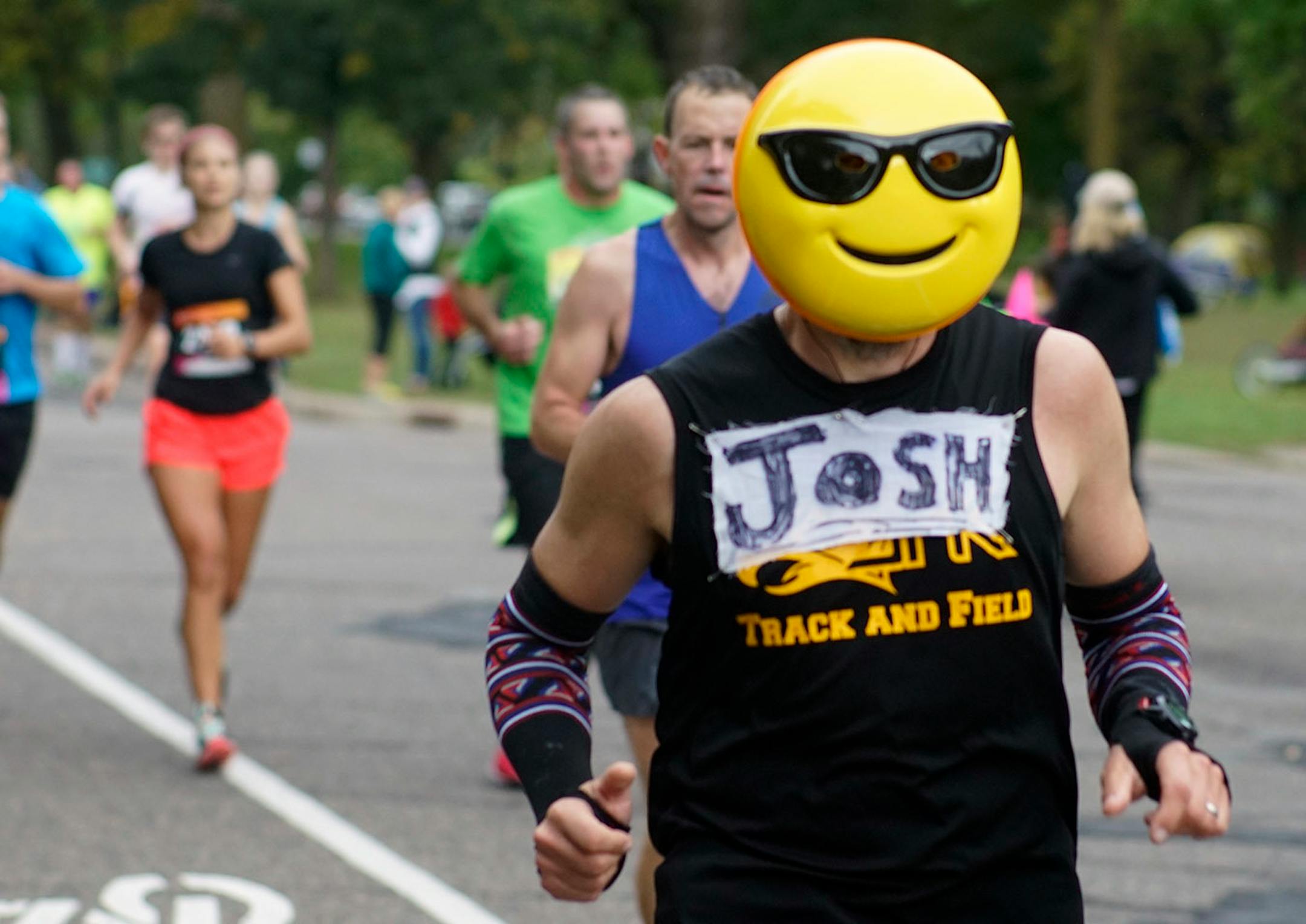 A runner proclaiming to be "Josh" ran with a smiley face mask.