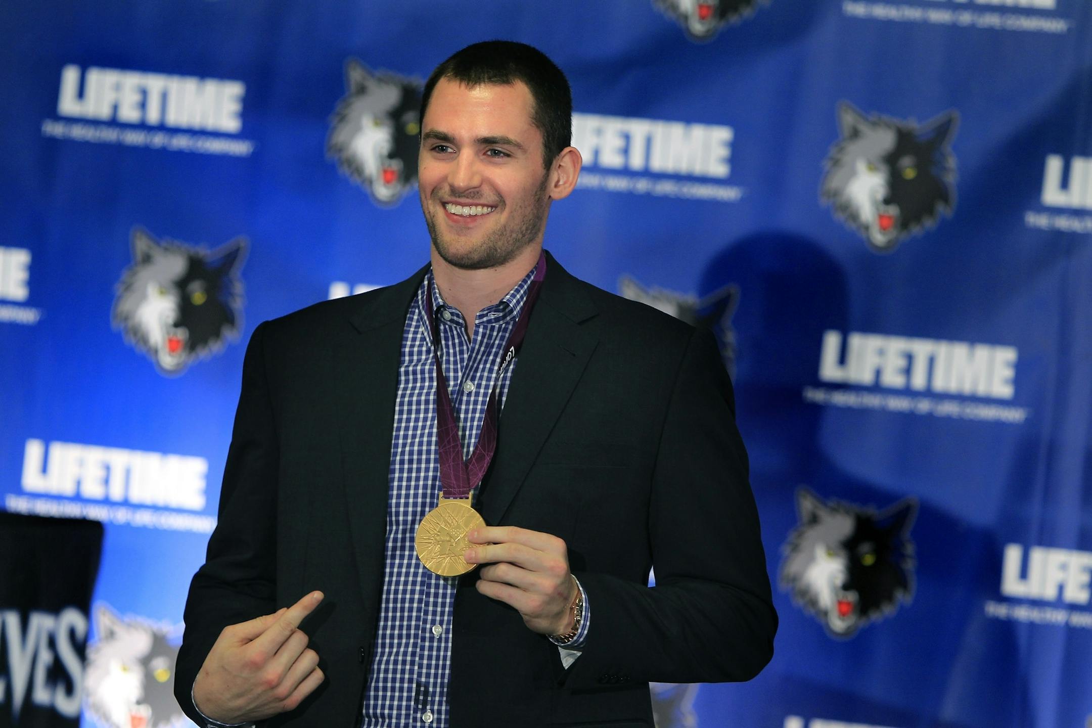 Timberwolves' Kevin Love showed off his 2012 Olympic gold medal after a press conference at the Target Center, Tuesday, September 25, 2012 in Minneapolis, MN.