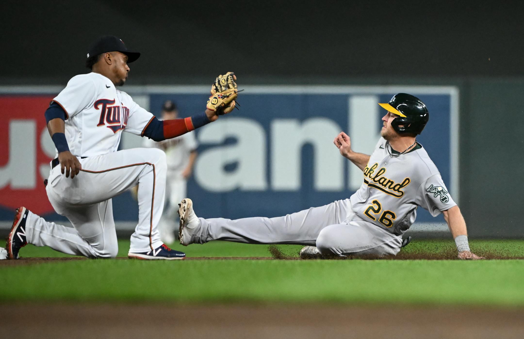 Oakland Athletics first baseman Sheldon Neuse (26) is caught stealing second base by Minnesota Twins second baseman Jorge Polanco (11) to end the top of the sixth inning.