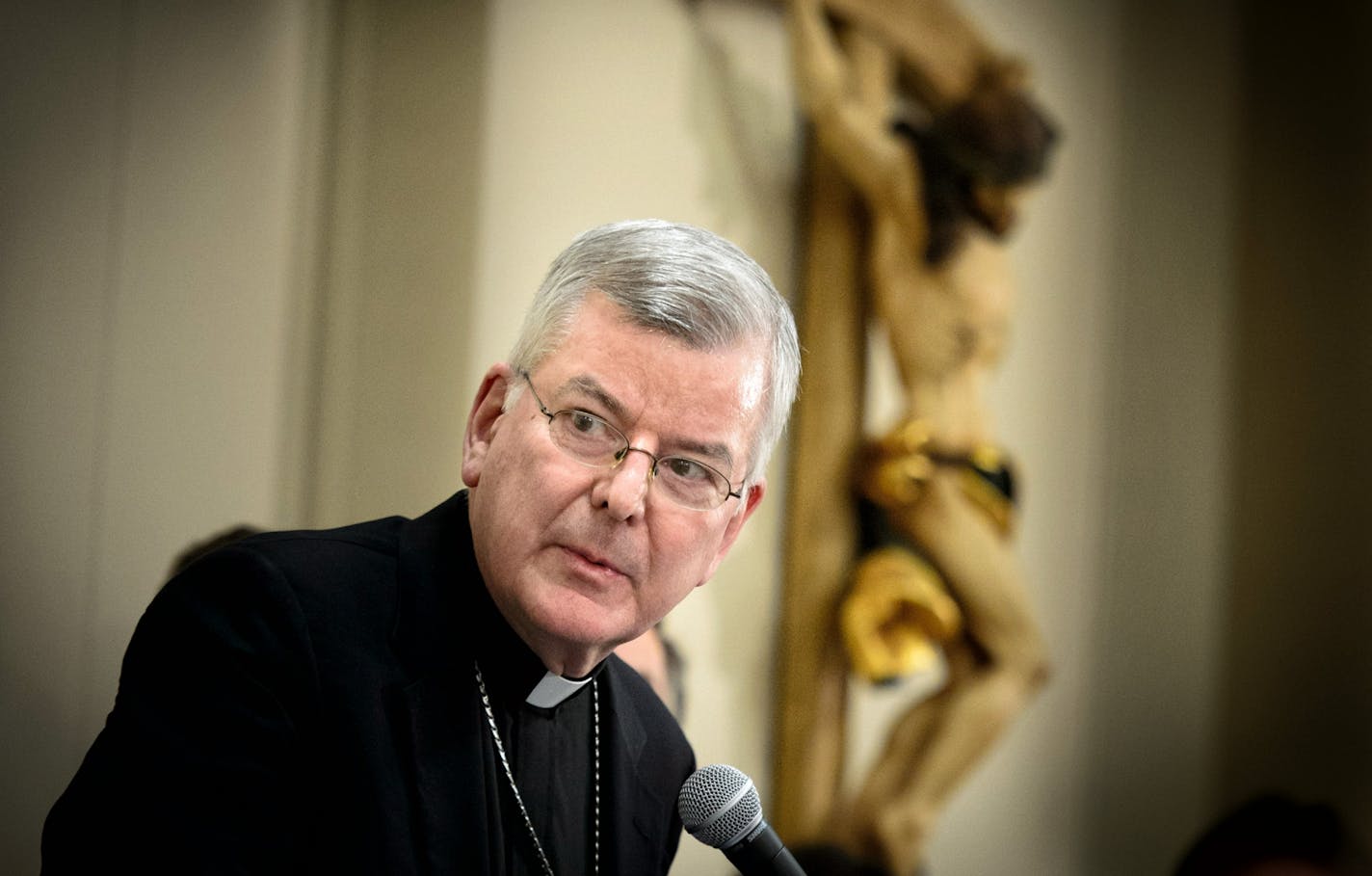 Archbishop Nienstedt leaves Michigan parish after backlash over his presence.