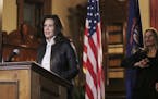 In a photo provided by the Michigan Office of the Governor, Michigan Gov. Gretchen Whitmer addresses the state during a speech in Lansing, Mich., Thur
