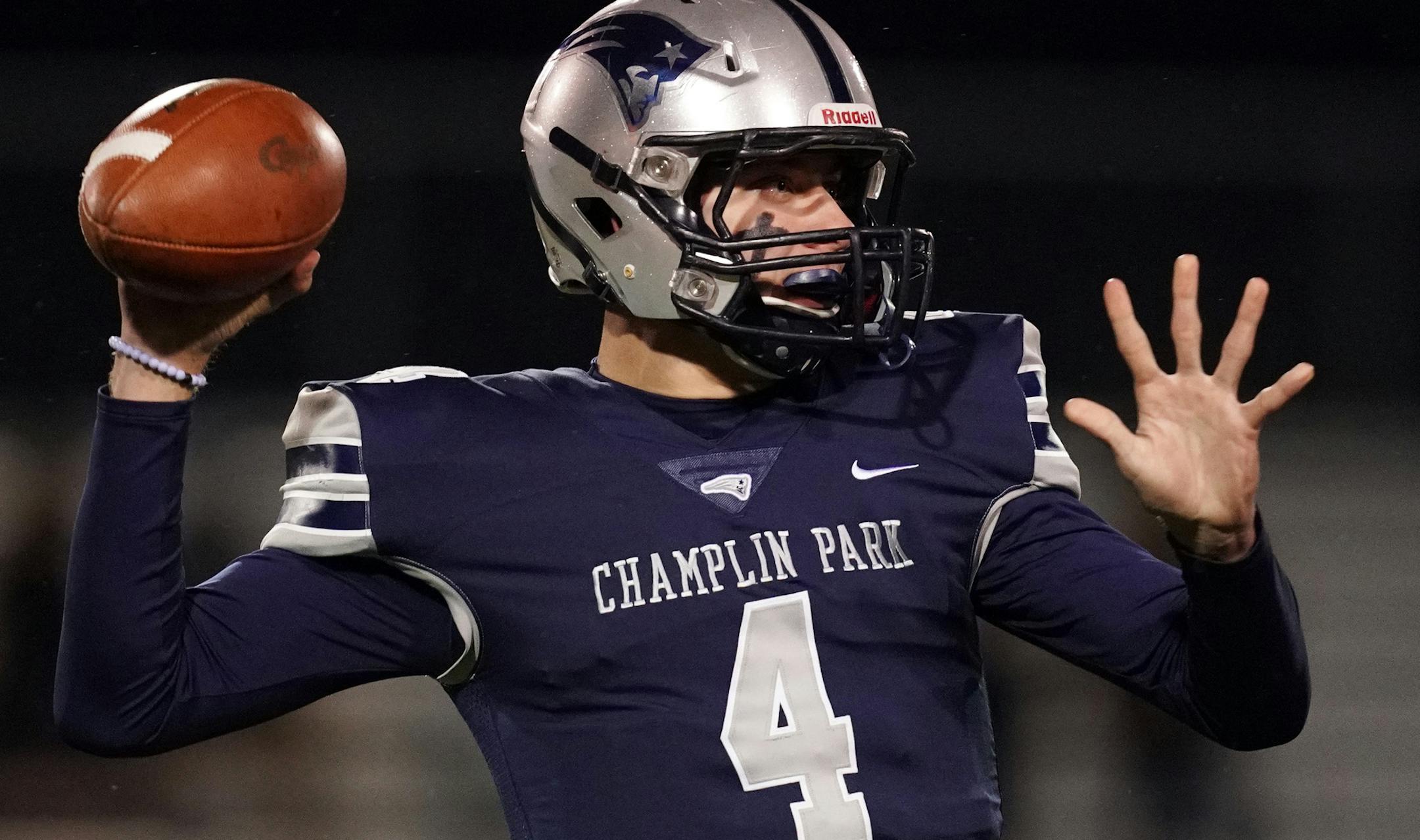 Champlin Park quarterback Jaice Miller (4) threw a touchdown pass to Champlin Park wide receiver Brock Johnson (3) in the first half. ] ANTHONY SOUFFLE • anthony.souffle@startribune.com Champlin Park played Totino-Grace in an MSHSL football game Friday, Oct. 11, 2019 at Champlin Park High School in Champlin, Minn.
