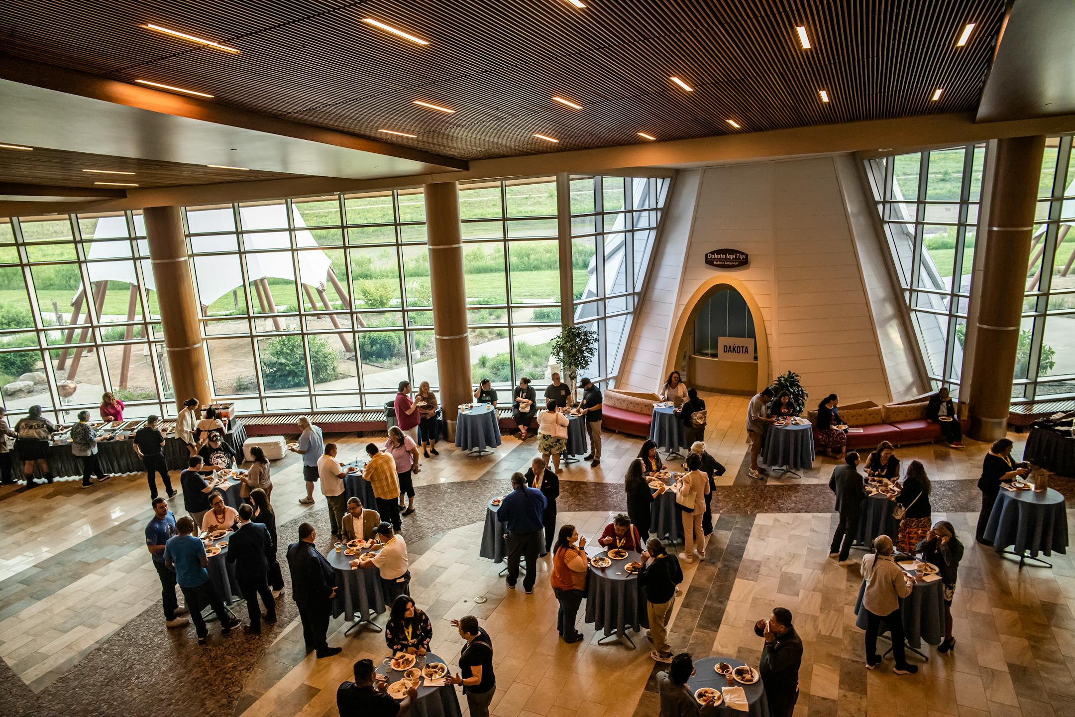 Attendees of the National Congress of American Indian's Mid Year conference break for dinner that includes elk, bison, and other Native American foods in Shakopee, Minn., on Wednesday, June 7, 2023.
