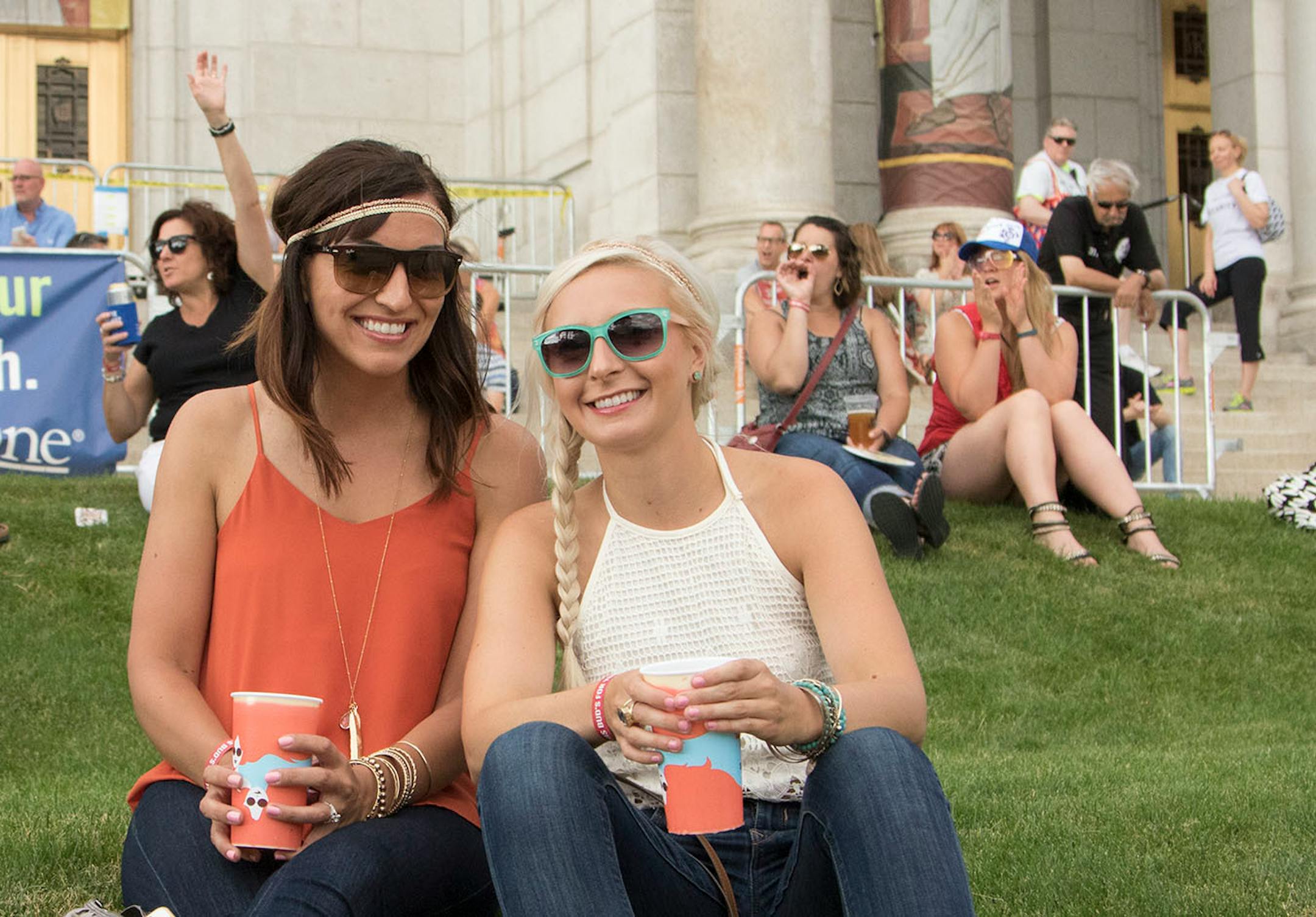 Tanya Neisen and Lisa Schraufnagel enjoya grassy seat as Andra Day performs on day one of the 2016 Basilica Block Party on July 8, 2016 at the Basilica in Minneapolis, Minn.