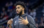 Minnesota Timberwolves center Karl-Anthony Towns addresses the crowd at Target Center about Kobe Bryant and his daughter Gianna before the start of Mo