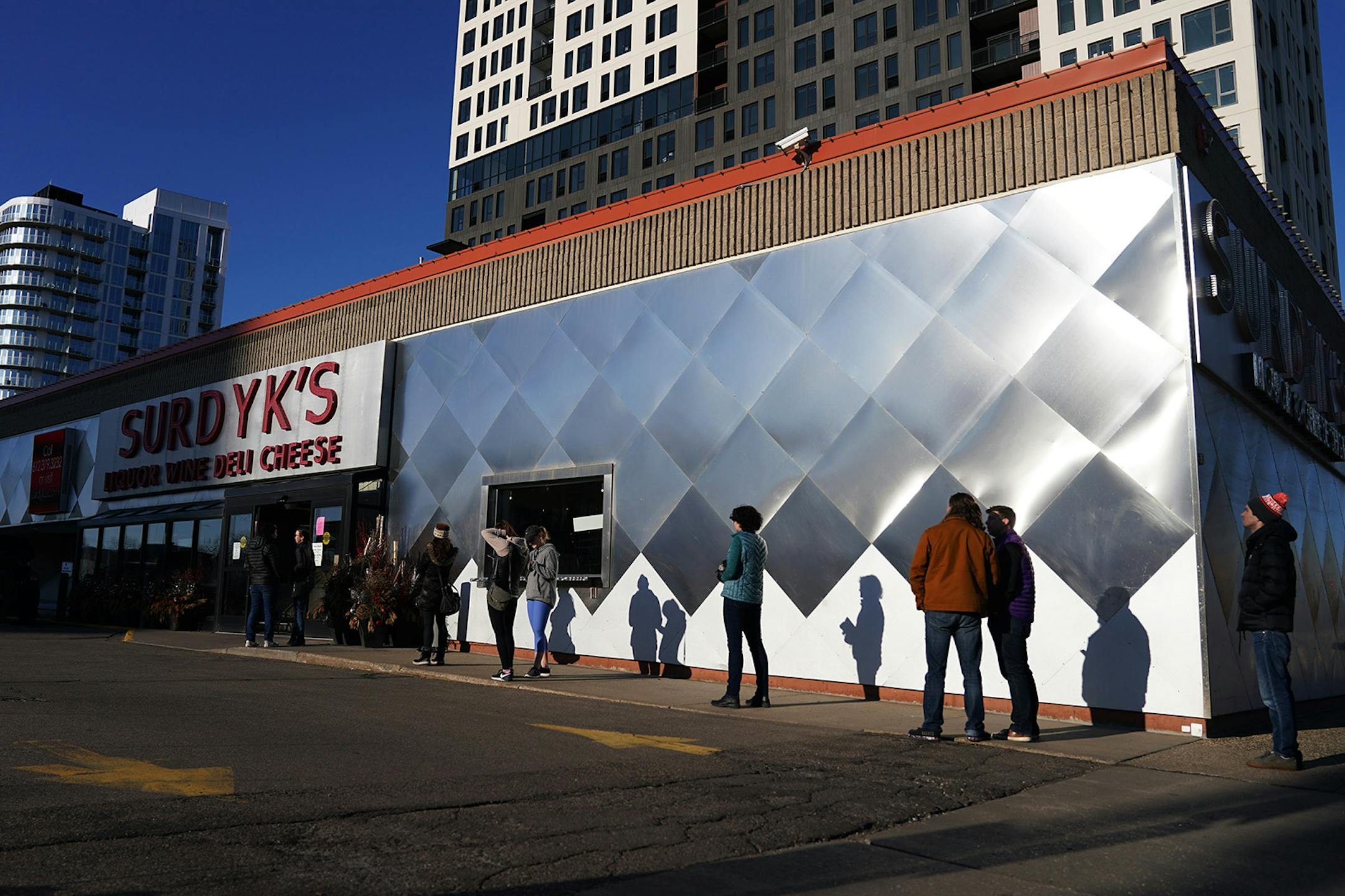 A line of socially distant customers formed outside of Surdyk's on Hennepin as they limited how many customers could be in at one time while the country continued to deal with the Coronavirus pandemic.