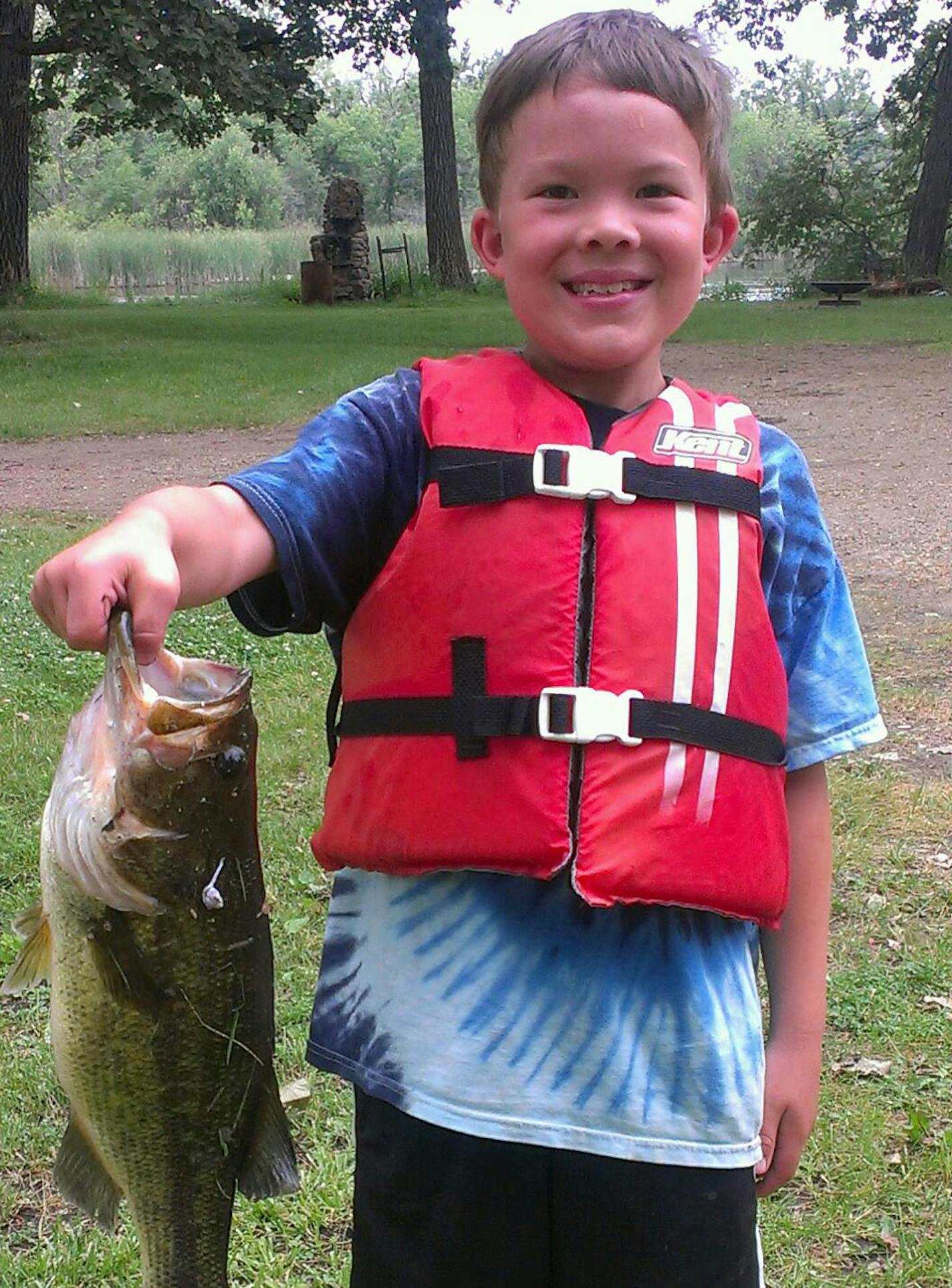 RIVER BASS: Soren Oyen Kung, 9, of Minneapolis caught this 16-inch largemouth bass on a spinner bait while drift-fishing the Otter Tail River. The bass was a diver, not a jumper, so Soren ended up with a furious fight in fast current.