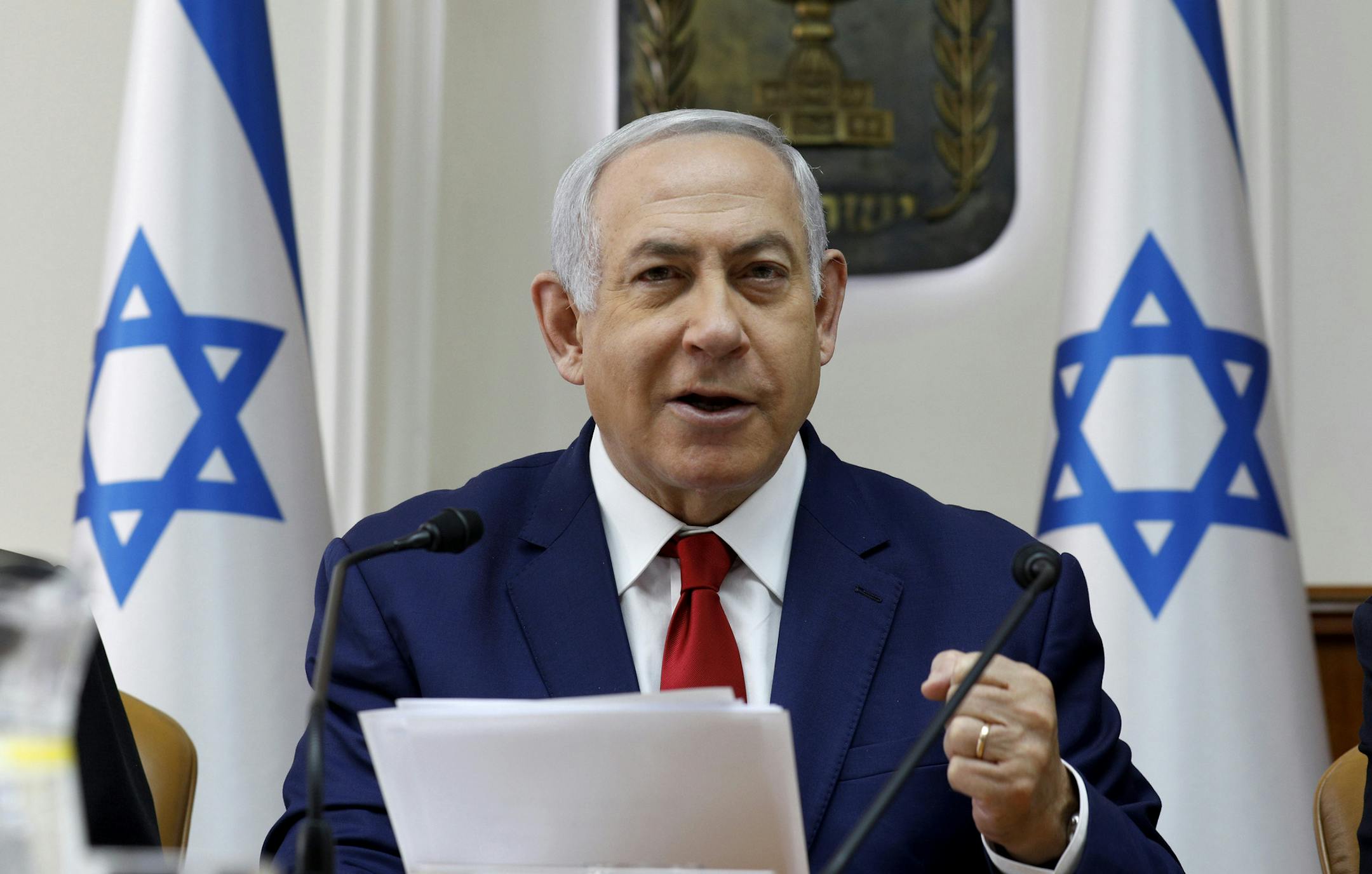 Israeli Prime Minister Benjamin Netanyahu opens the weekly cabinet meeting at the prime minister's office in Jerusalem, Sunday, Jan. 6, 2019. (Gali Tibbon/Pool via AP)
