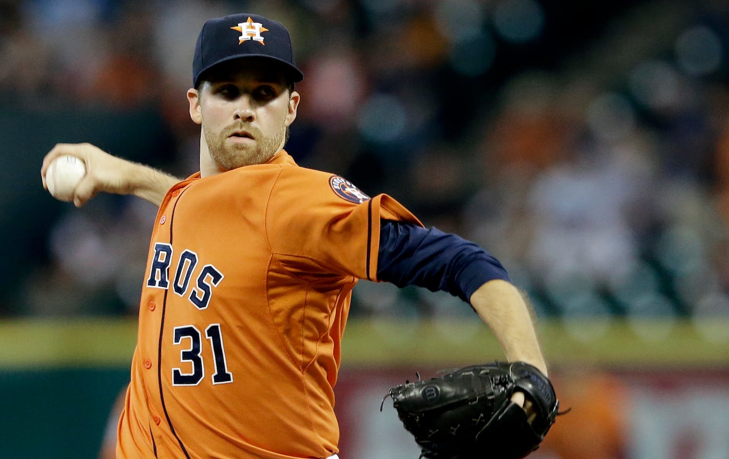 Houston Astros' Collin McHugh delivers a pitch against the Minnesota Twins in the first inning of a baseball game Friday, Sept. 4, 2015, in Houston. (AP Photo/Pat Sullivan)