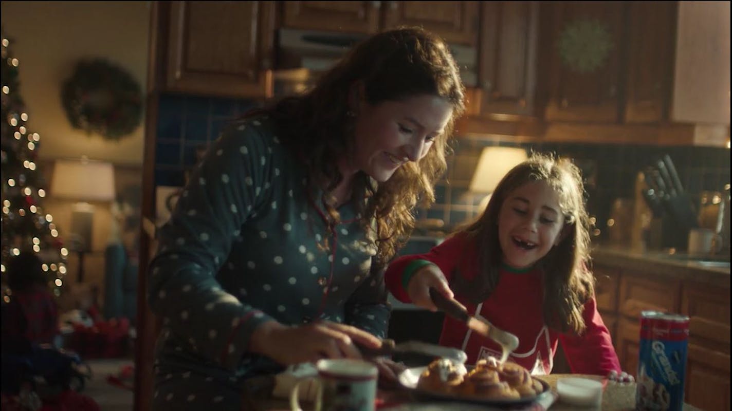 A scene from Pillsbury&#x2019;s latest ad campaign shows a mother and daughter baking cinnamon rolls. In some theaters where the ad runs, the company will use scent-diffusing machines to waft a cinnamon smell.