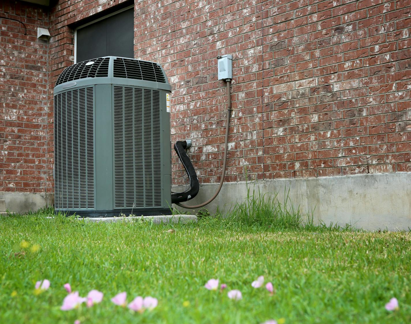 High efficiency modern AC-heater unit on brick wall background