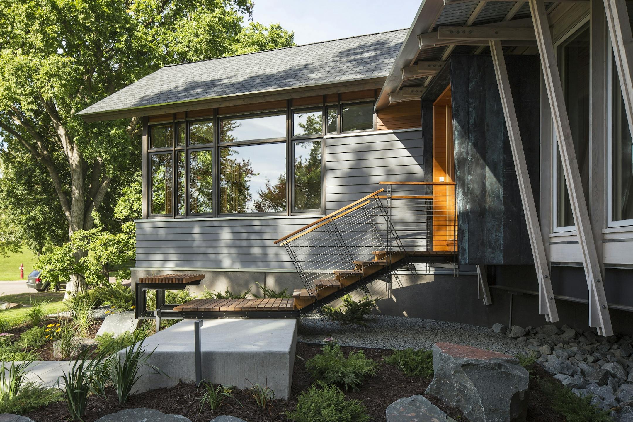 Troy Thies side view of front entry, Home of the Month on lake of the Isles