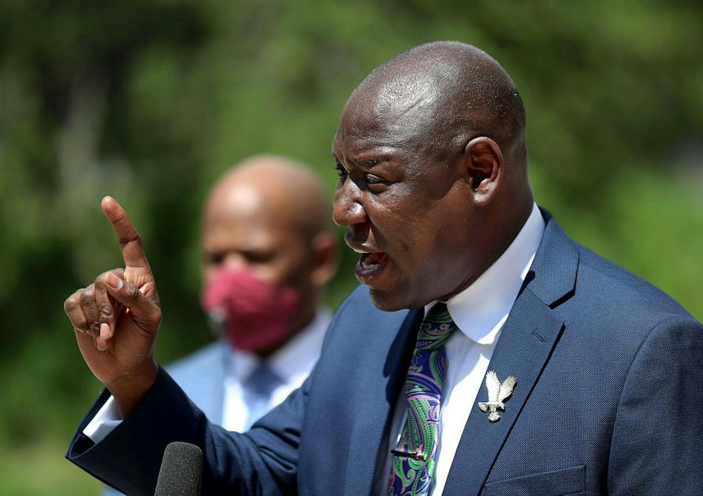 Attorney Ben Crump, who represents George Floyd's family, announced in a press conference that the family of Floyd is suing the city of Minneapolis and the four officers involved in his death, citing a failure in proper police training and a racist departmental culture that led to a "reckless disregard" of Floyd's civil rights Wednesday outside the US Federal Courthouse in Minneapolis. Here, Crump is seen at the podium surrounded by his team of lawyers.