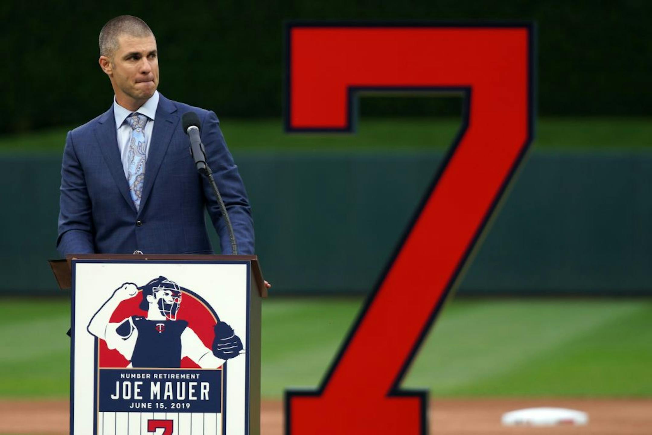 Former Minnesota Twins star Joe Mauer fought back tears as he spoke during a pregame ceremony to retire his number 7 Saturday.